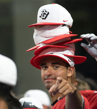 player with a stack of PG hats